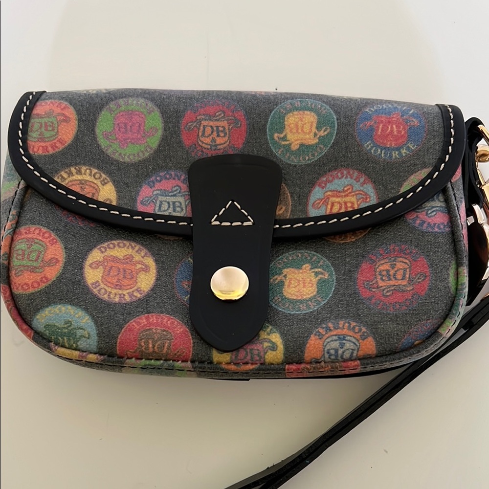 Dooney and Bourke Coated Canvas Wristlet in Logo Medallion Print